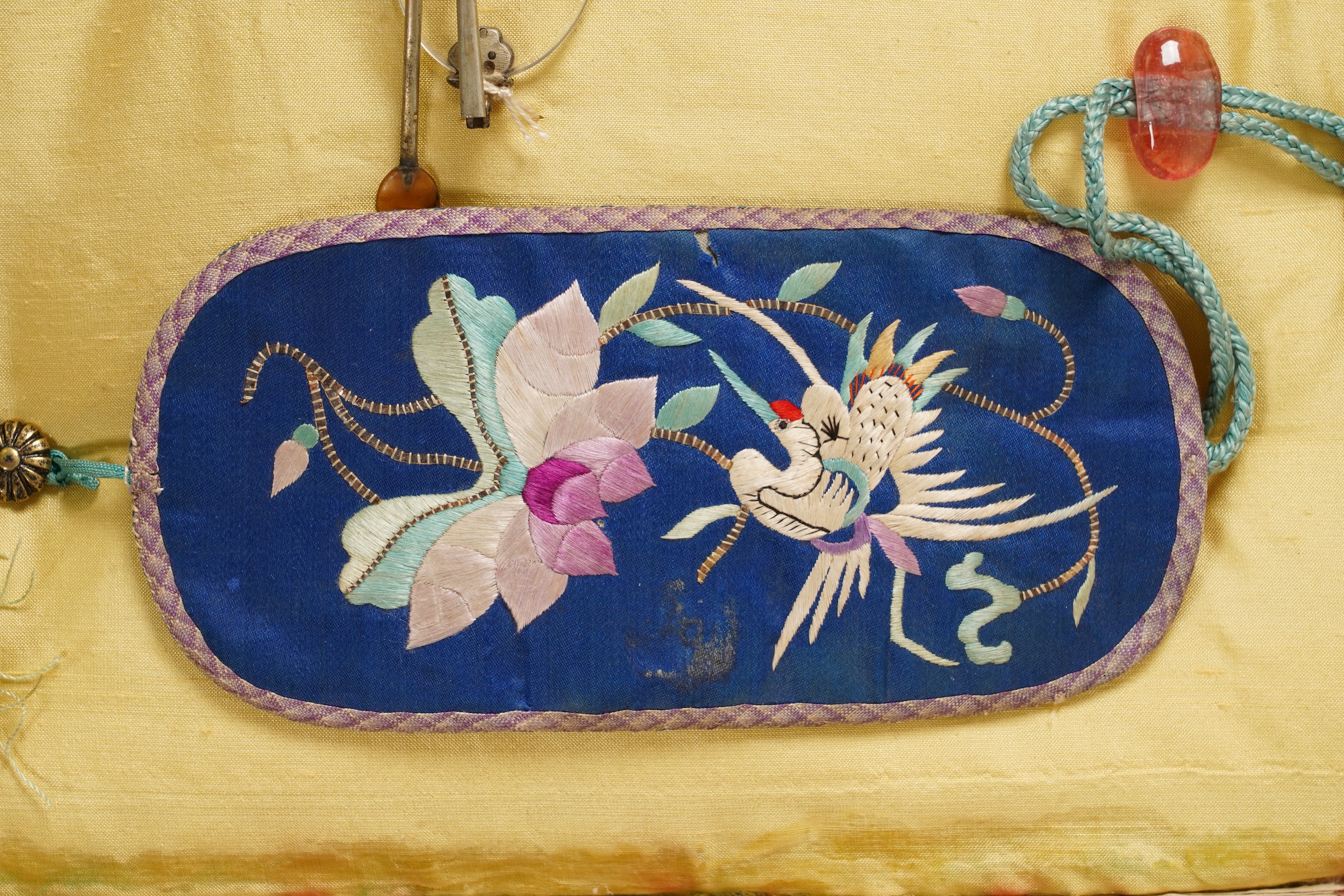 A collection of 19th/20th century Chinese embroidered silk spectacle cases and various spectacles, Box 33cm square